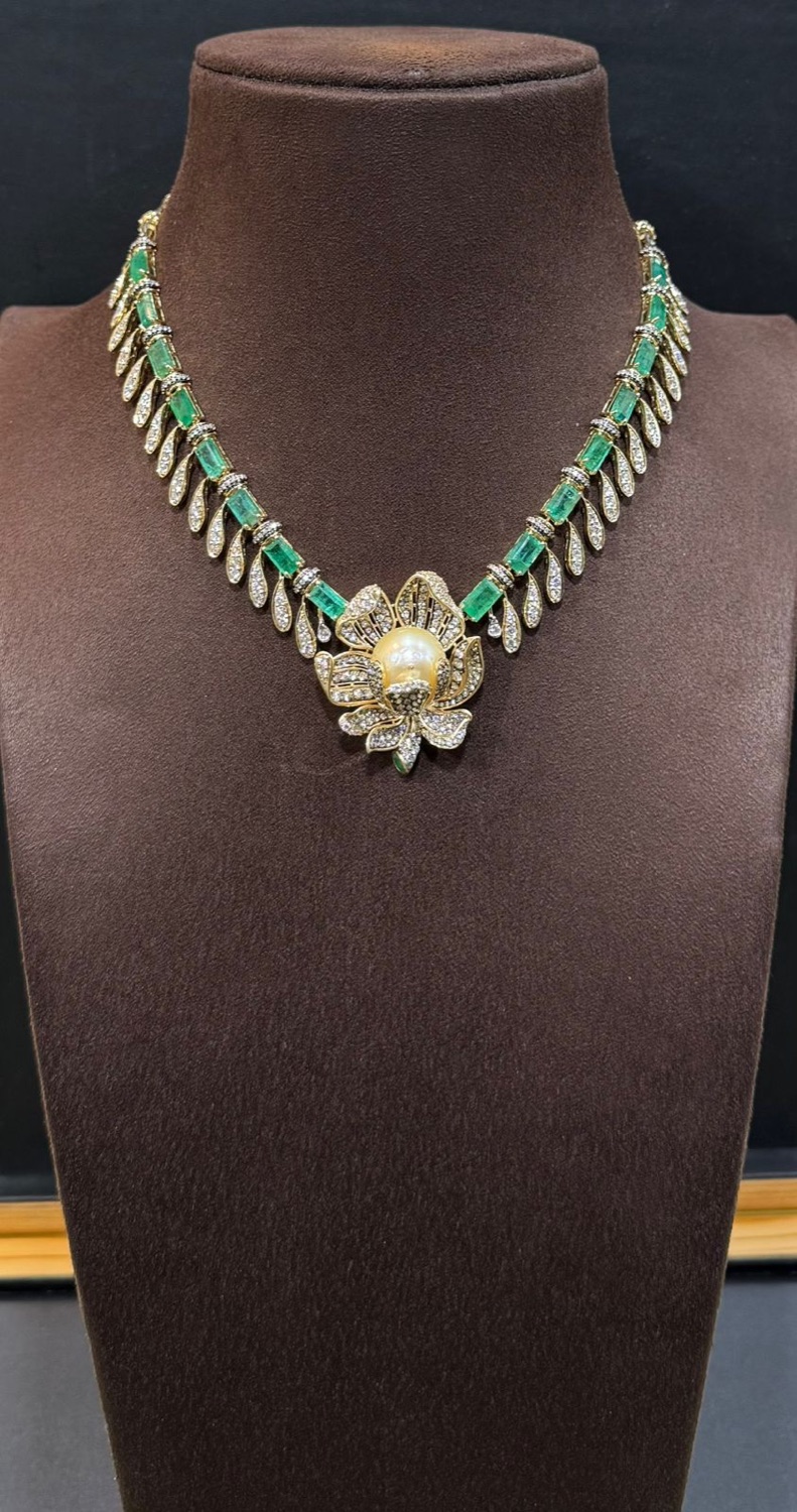 Emerald and pearl detail
